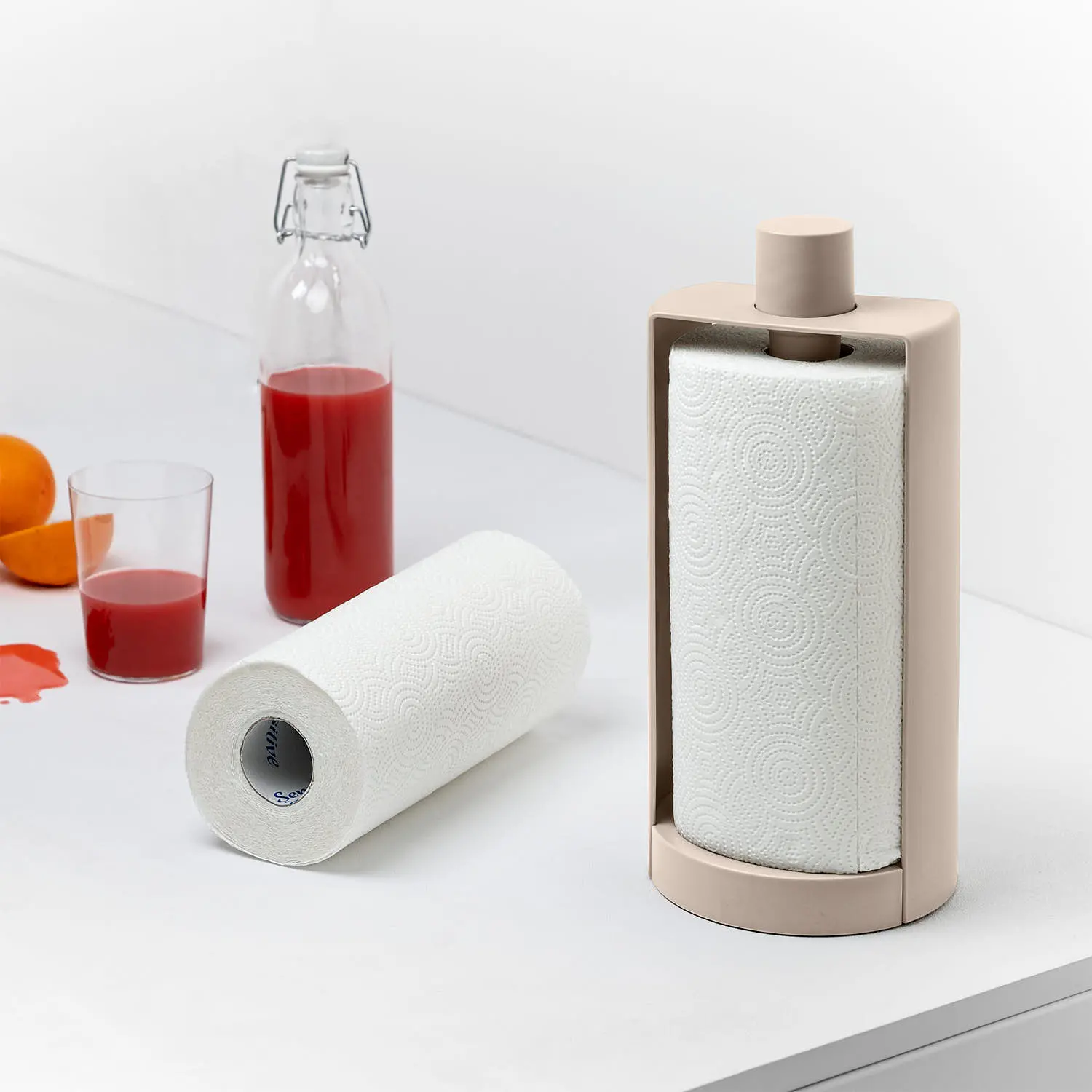 Stop Blim Plus: portarotolo in colorazione Moka Grey, con succo nello sfondo